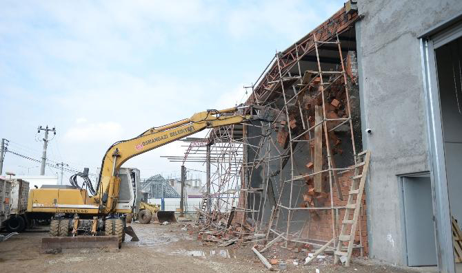 Decommissioning a contaminated site may include the demolition of structures